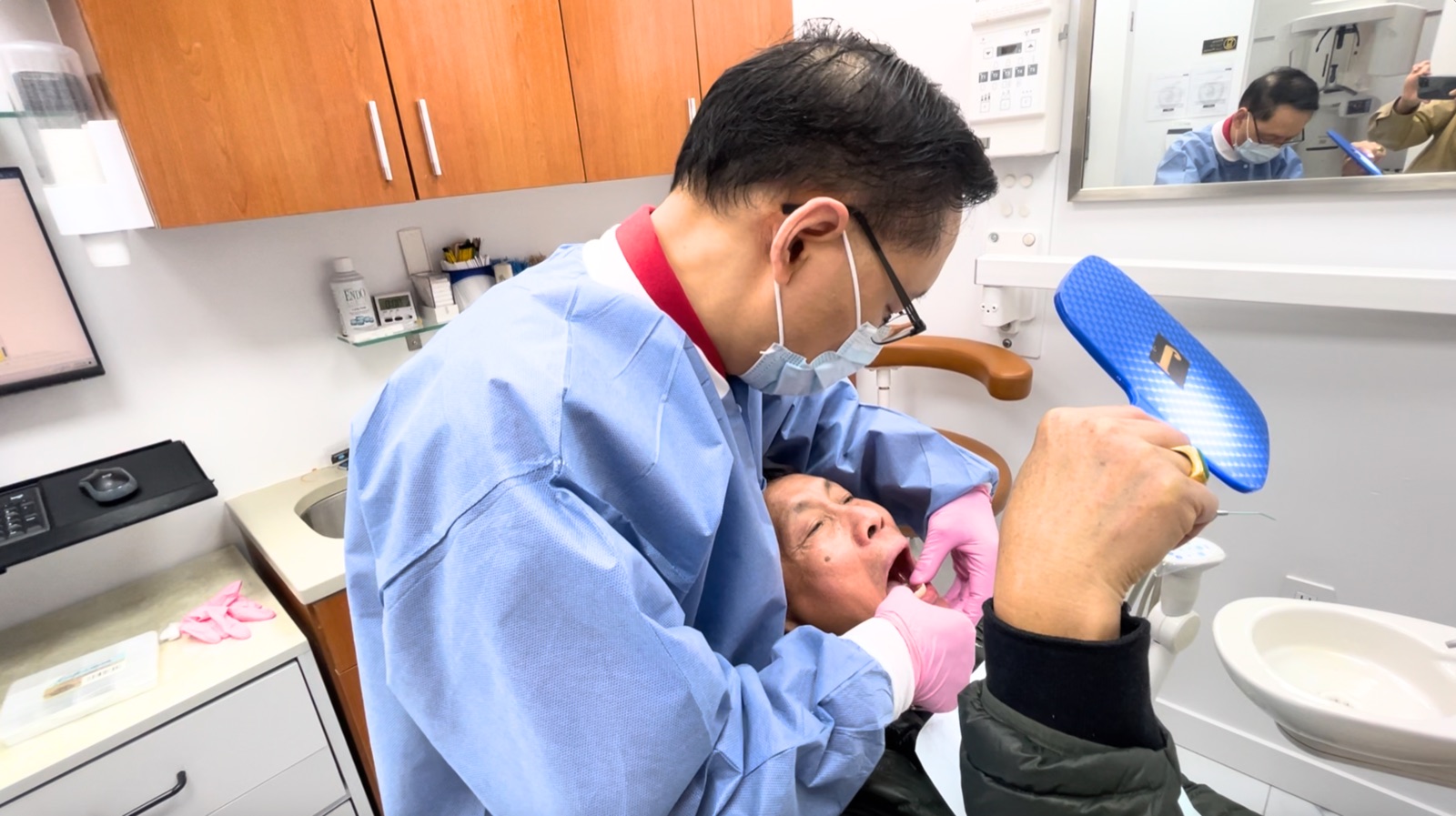 NYC dentist gently explaining treatment to a patient at Centre Dental