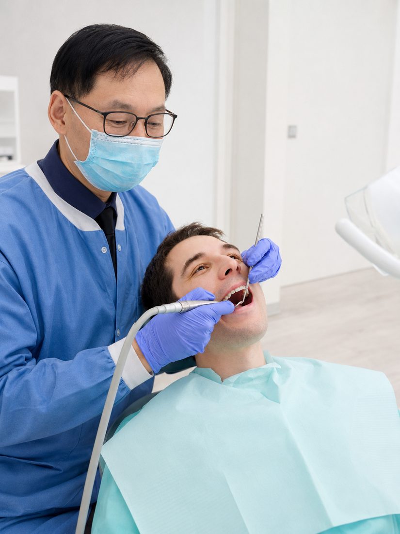 Centre Dental NYC dentist providing warm, attentive care to a relaxed patient